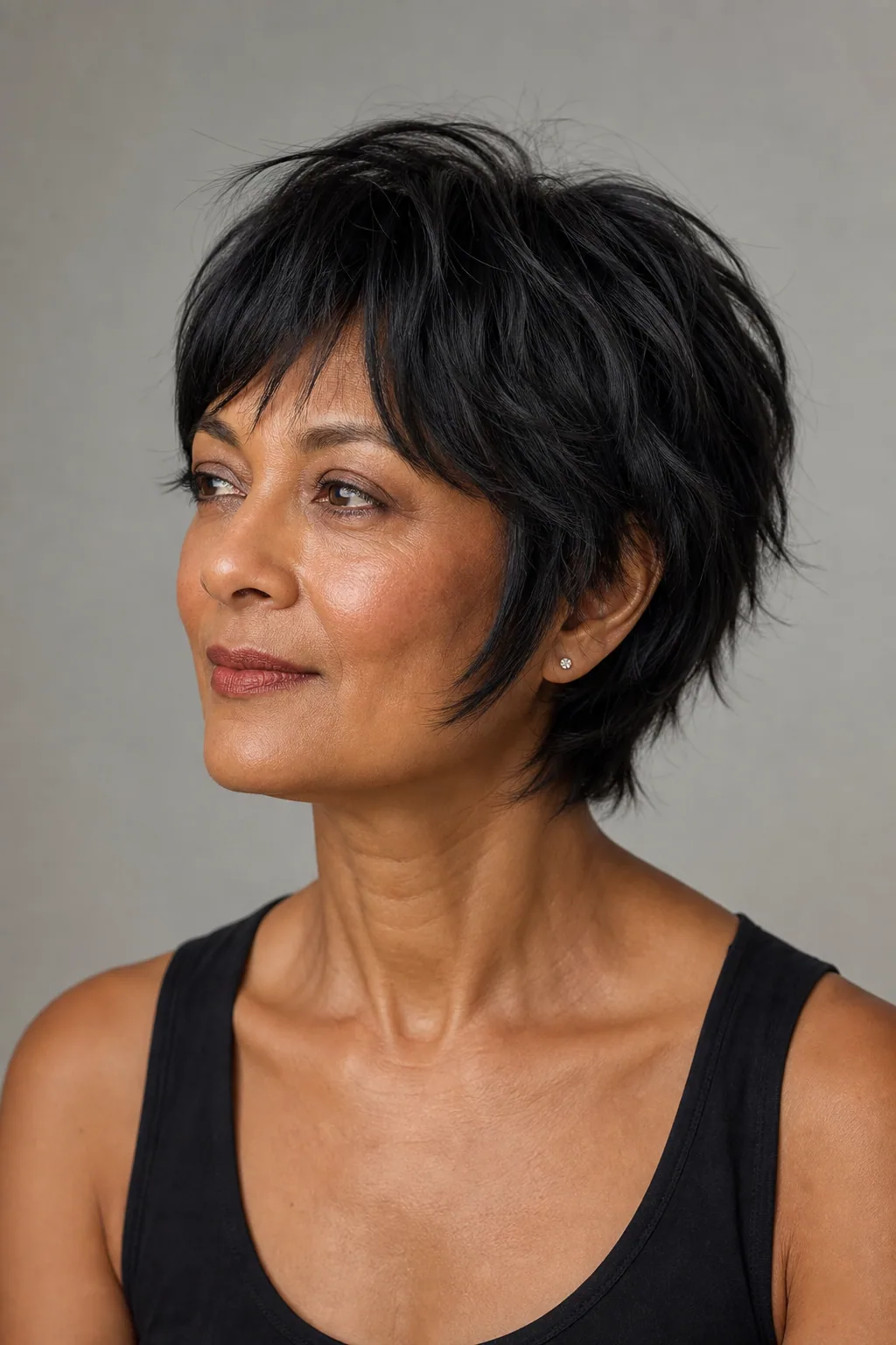 Bixie shag between a bob and pixie with soft layers and length at the sides on fine hair