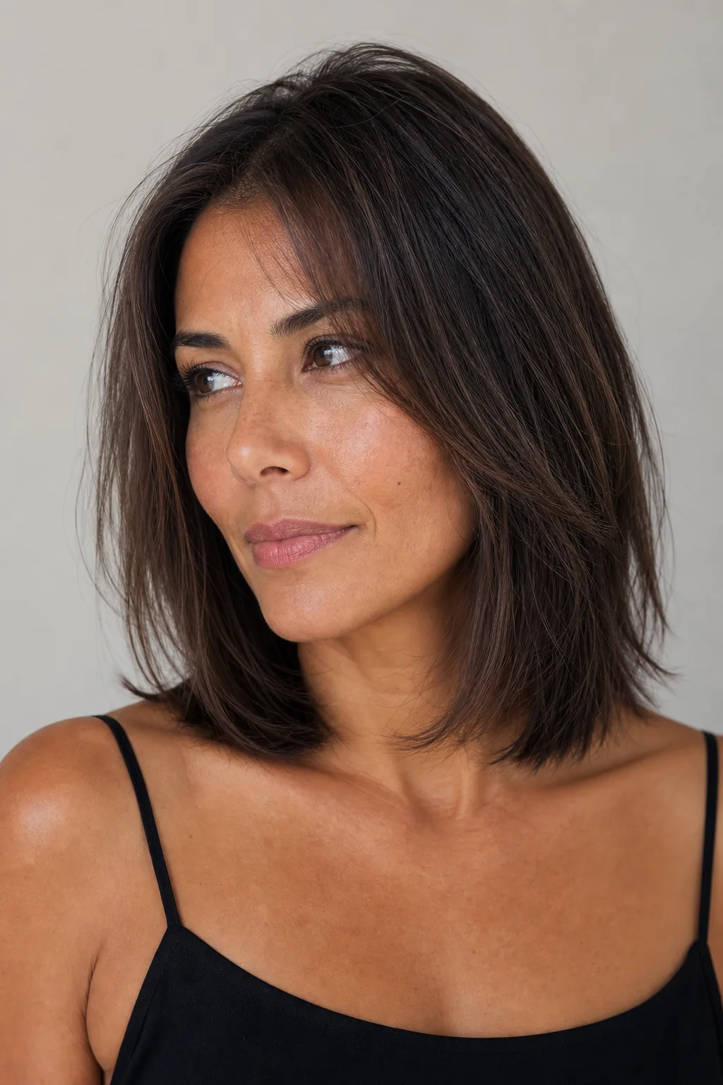Collarbone layered lob with soft internal layers holding body on fine straight hair