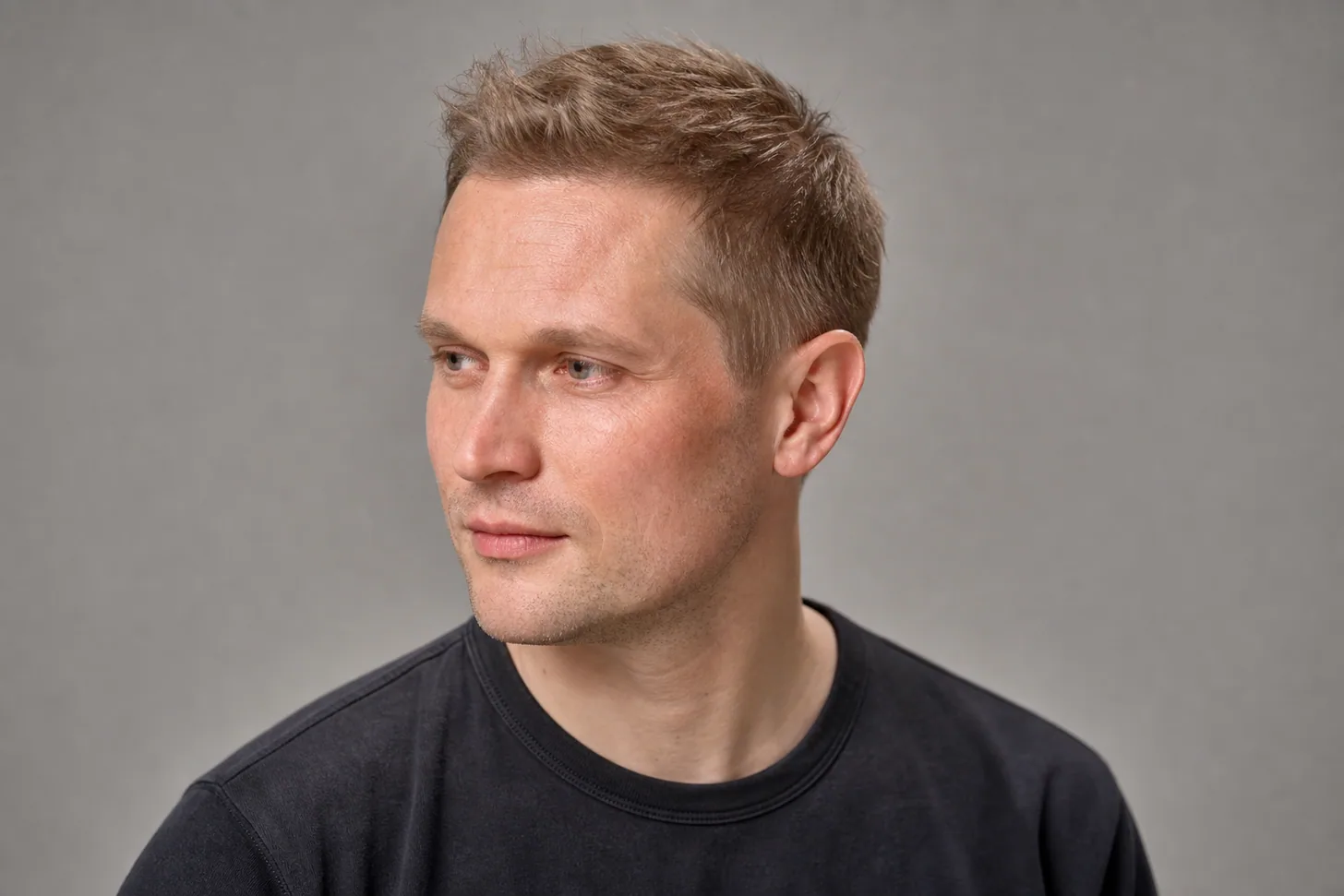 Classic crew cut on a man with thin light-brown hair