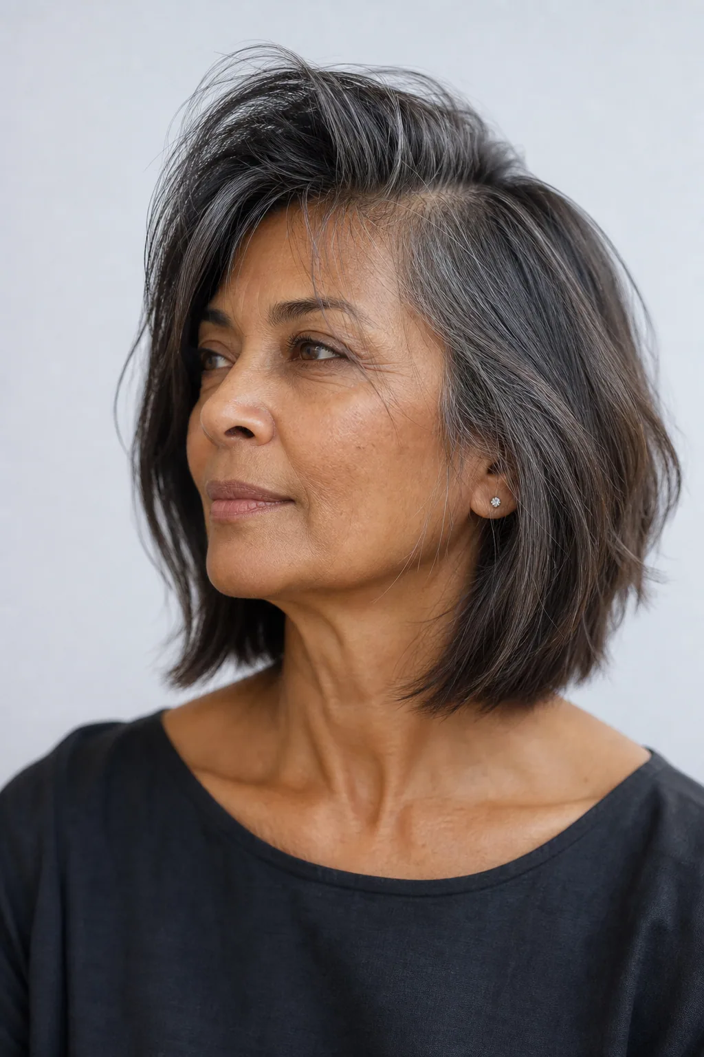 Deep-side-part lob with a sweep over the forehead and crown lift on fine hair