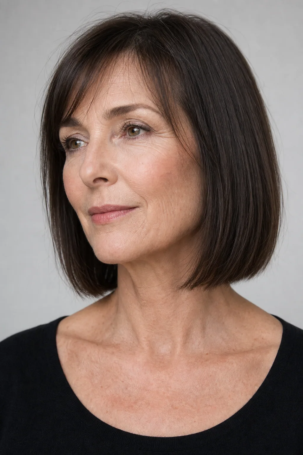 Heavy-hemline one-length lob just above the shoulders maximizing fullness on fine thin hair