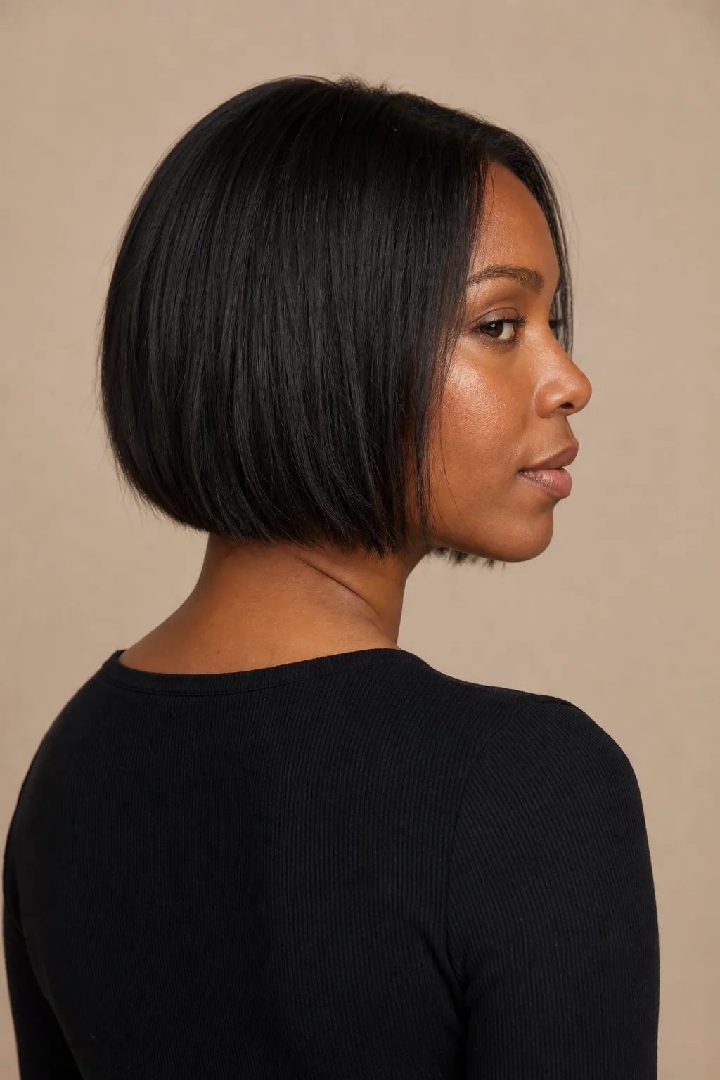 Neck-length blunt bob with a heavy level line on fine black hair