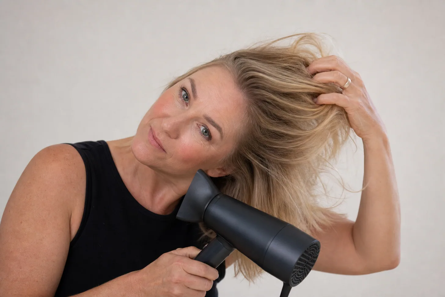 Rough-drying fine hair upside down on medium heat to lift the roots at the crown