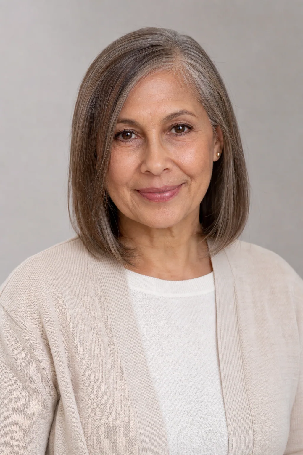 Shoulder-length cut with face-framing pieces on fine brown hair over 60