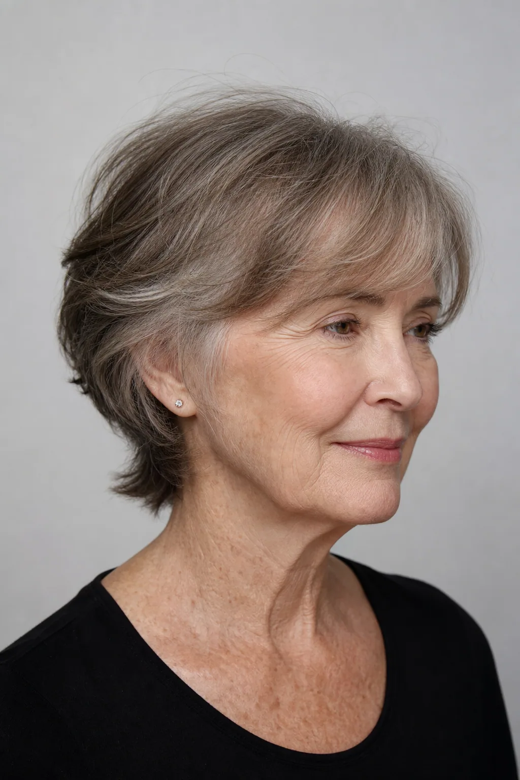 Side-swept face-framing layers covering a thinning crown on fine thin hair over 60