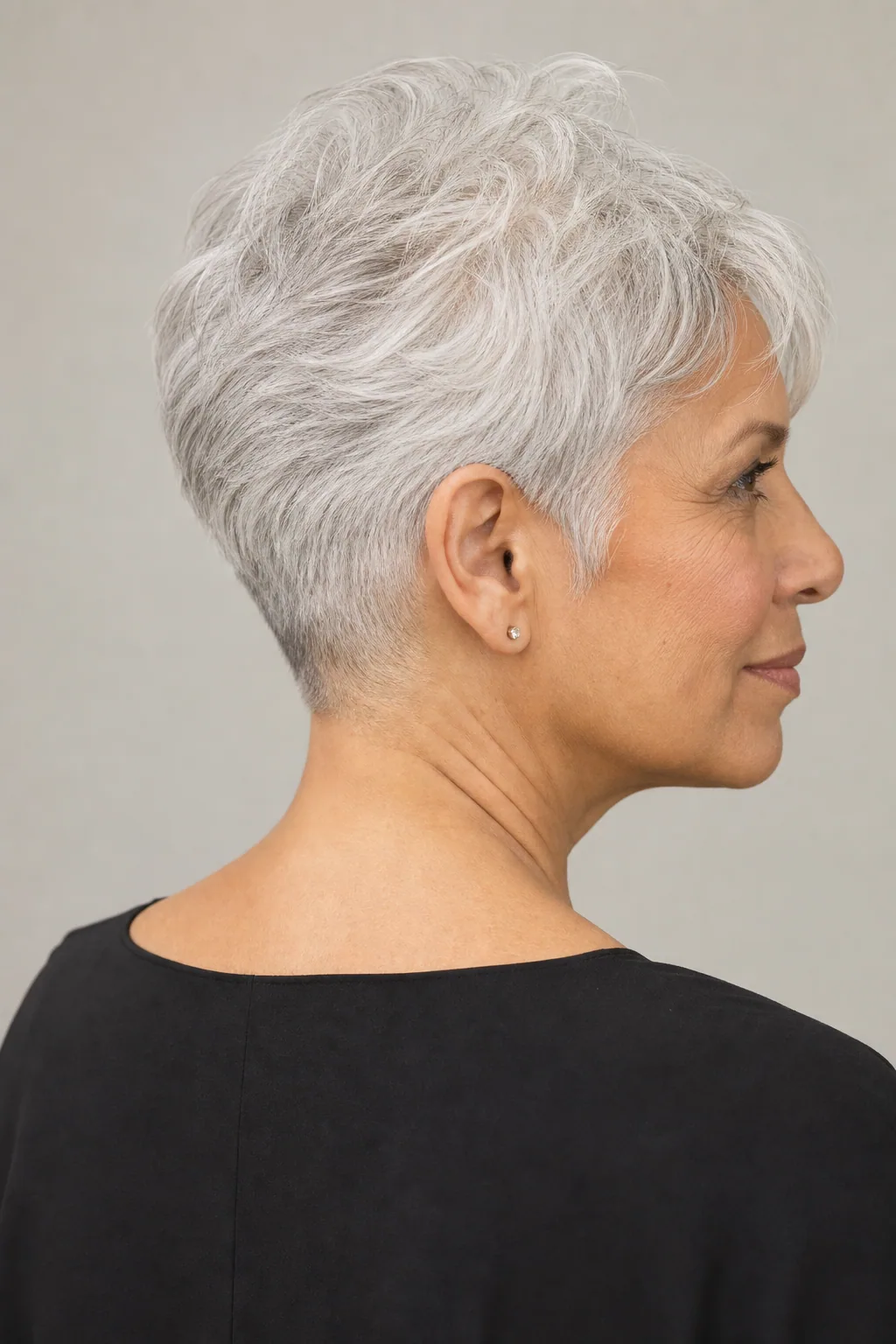 Tapered pixie with a clean short nape on fine thin silver hair over 60