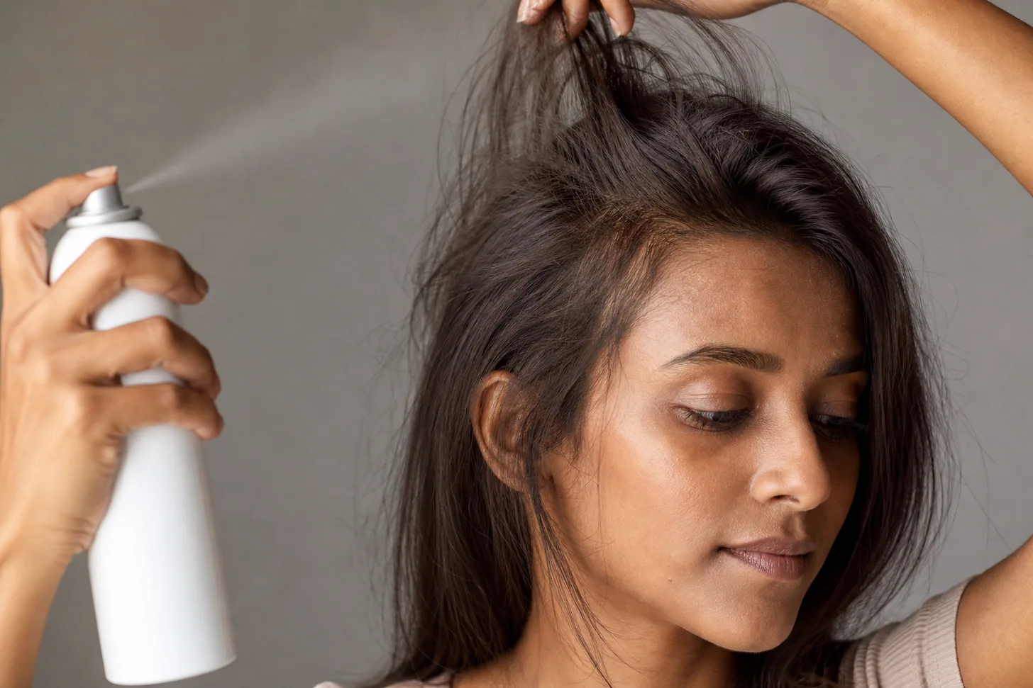 Texture spray misted over lifted roots to finish revived second-day fine hair