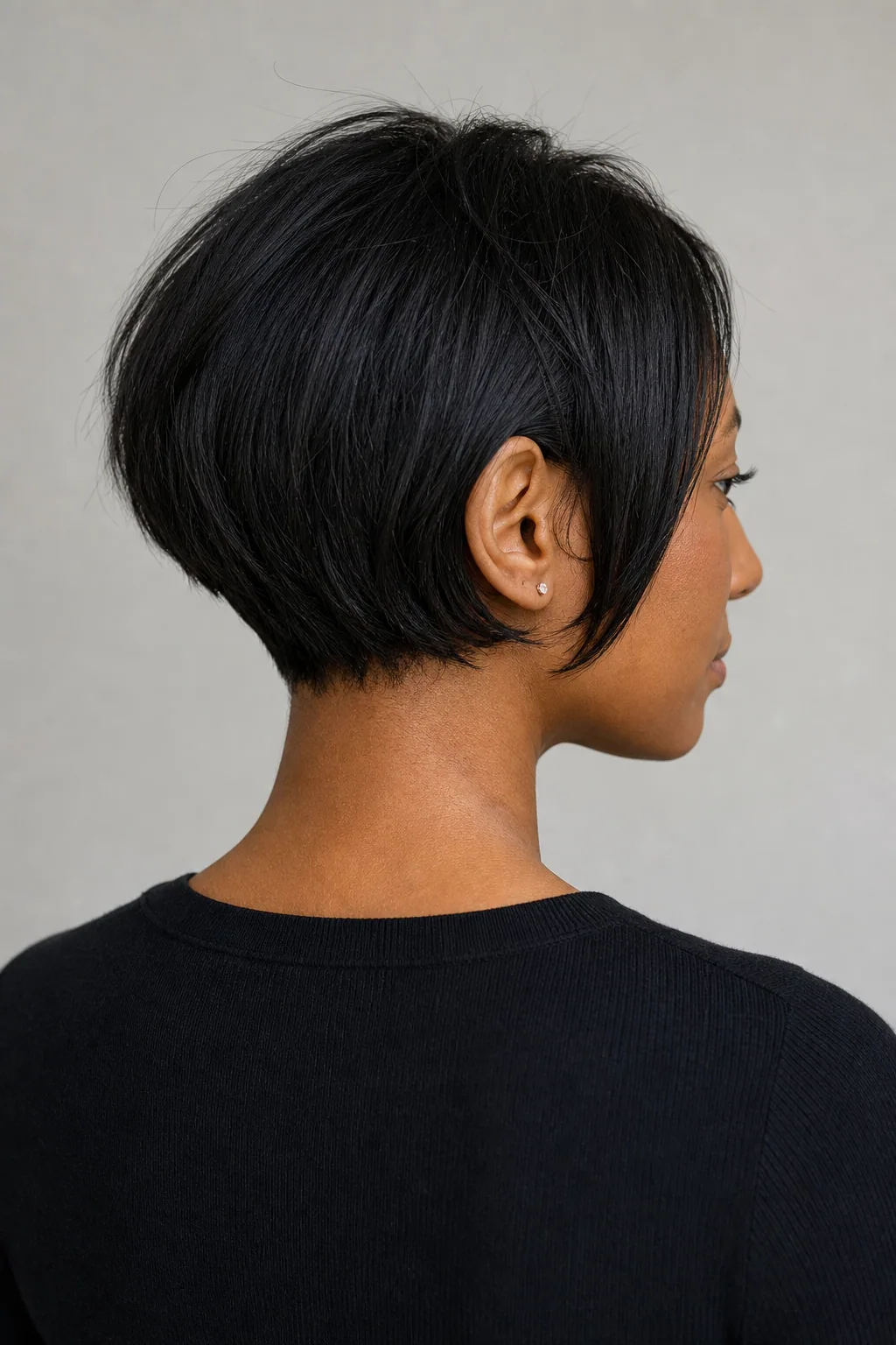Very short bob with a tapered nape on fine black hair