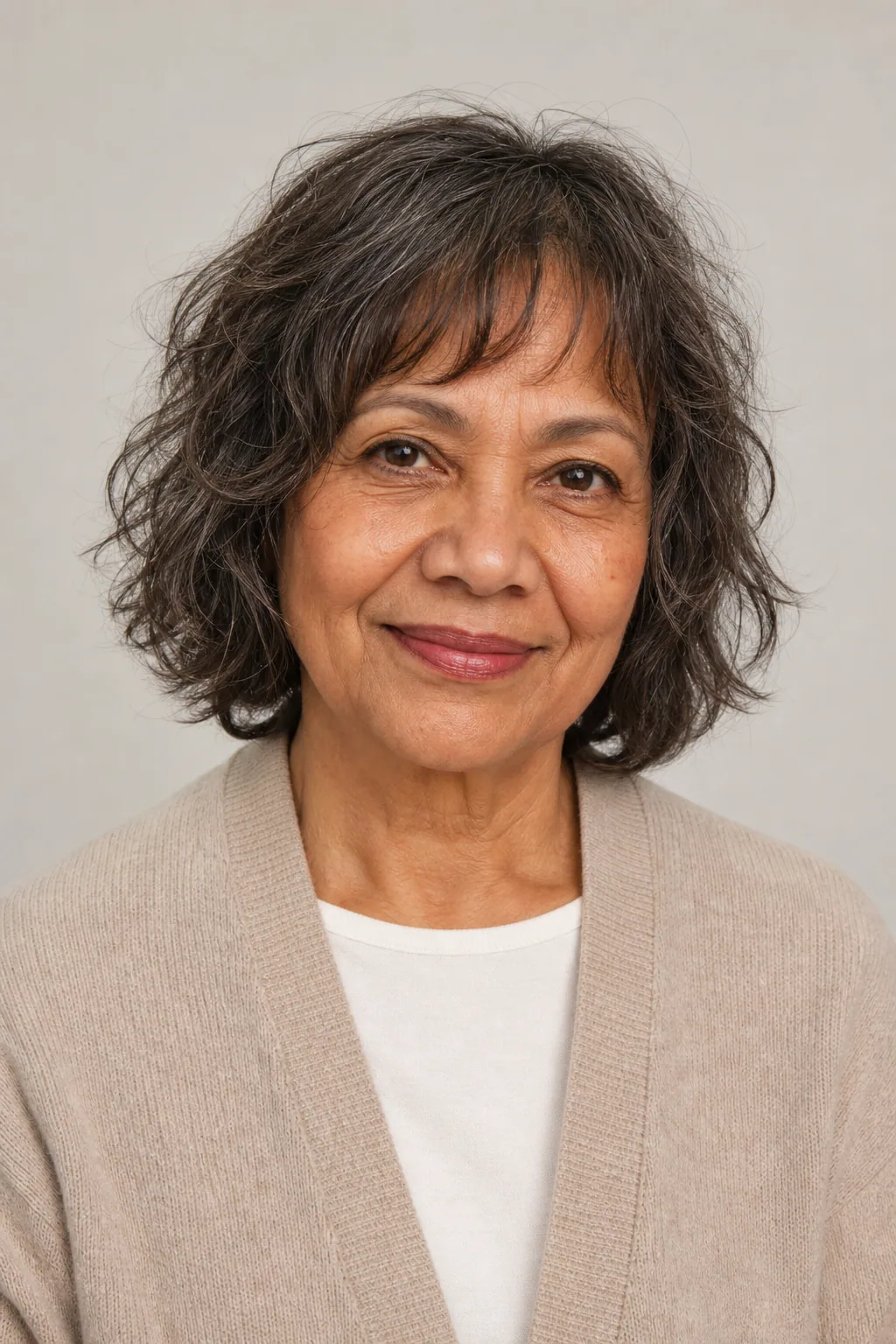 Air-dried wavy shag on fine dark-brown hair with gray, over 60